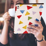 a girl is holding and viewing personalized iPad folio case with Geometry Pattern design
