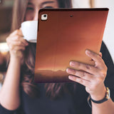 a girl is holding and viewing personalized iPad folio case with Father Day design