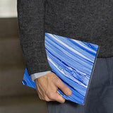 A business man holds Personalized VistaCase reMarkable Pen Holder Case with Futuristic design