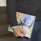 A business man holds Personalized VistaCase reMarkable Pen Holder Case with Watercolor Flower design