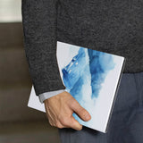 A business man holds Personalized VistaCase reMarkable Pen Holder Case with Watercolor View design