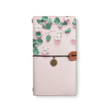 the front top view of midori style traveler's notebook with 4 design