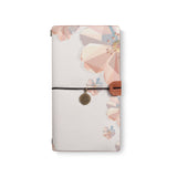 the front top view of midori style traveler's notebook with 4 design